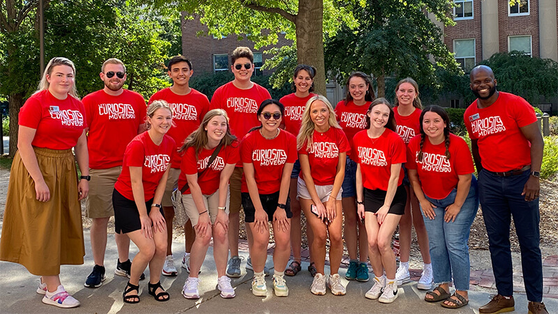 Group photo of students wearing matching organization shirts