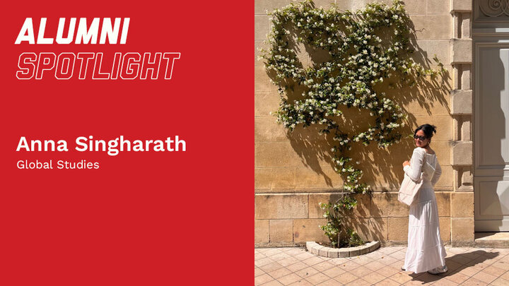 Person in white dress poses near sunlit wall with climbing greenery; text reads "Alumni Spotlight."